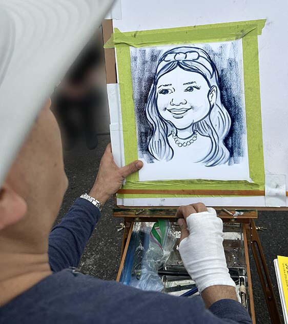 Ottawa caricature artist drawing at a live event Ottawa caricature artist